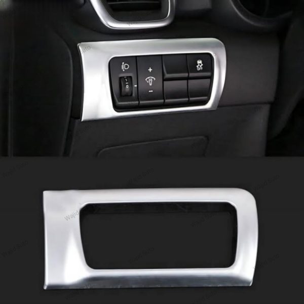 Silver frame on ac button of kia sportage.